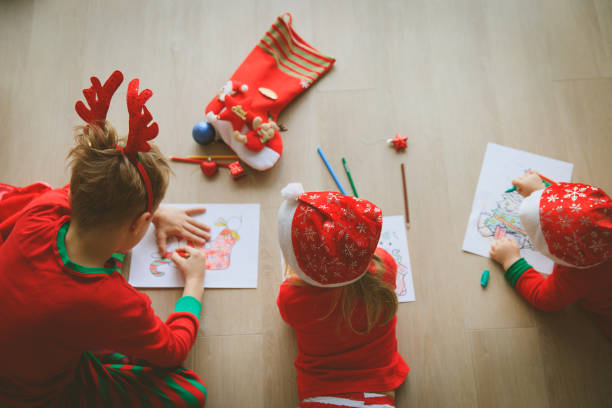 istock kids making Christmas crafts, family celebration 906777742