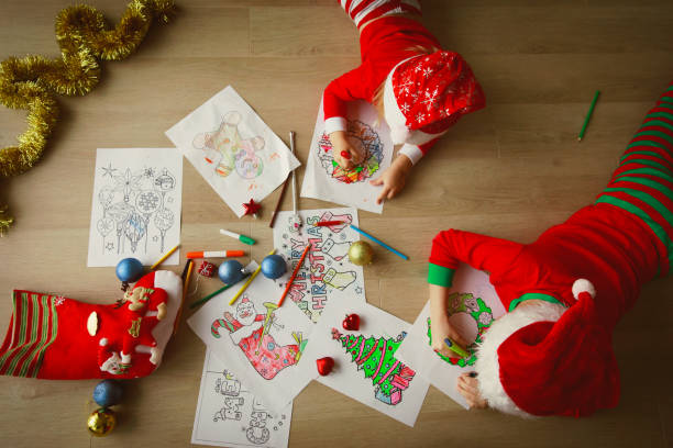 istock kids making Christmas crafts, family celebration 906778098