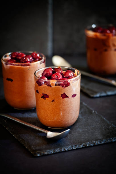 istock Glasses Of Chocolate Mousse With Cherry Topping 906778414