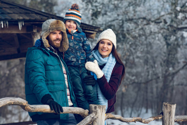istock Family enjoying winter day in the forest 906783014