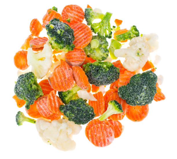 istock Mix of frozen vegetables on white background 906783372