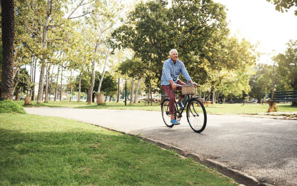 when you've got a bike, you've got everything - candid people casual bicycle imagens e fotografias de stock