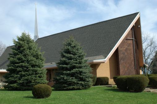 Rock Hill, SC, USA-10 April 2022: St. John's United Methodist Church main sanctuary building and monument sign.