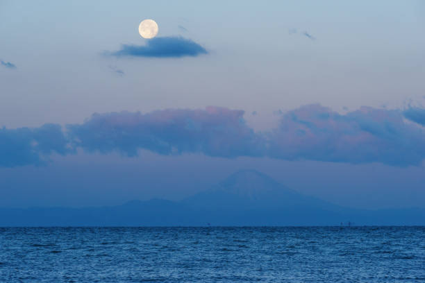 istock Mt. Fuji and Moon during Sunrise 906786524