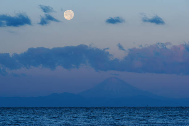 istock Mt. Fuji and Moon during Sunrise 906786758