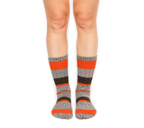 istock Female feet in warm socks 906788052