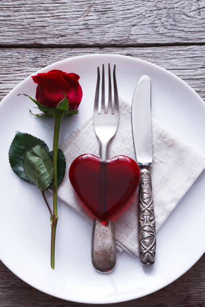 istock Valentine day background red glass heart on the plate 906790664