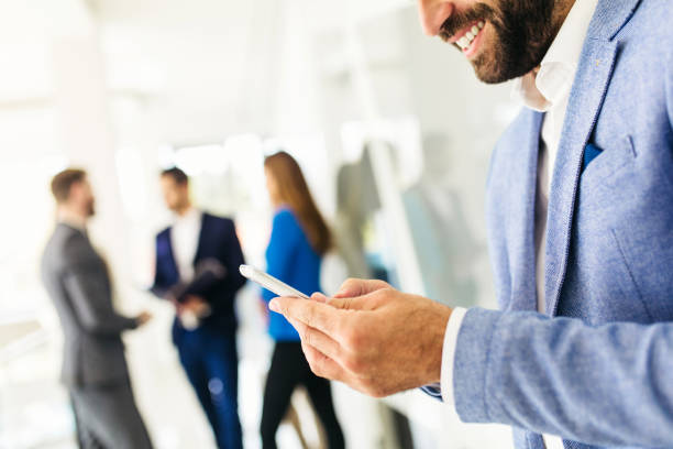 istock Young handsome businessman talking on the phone in modern office 906791564
