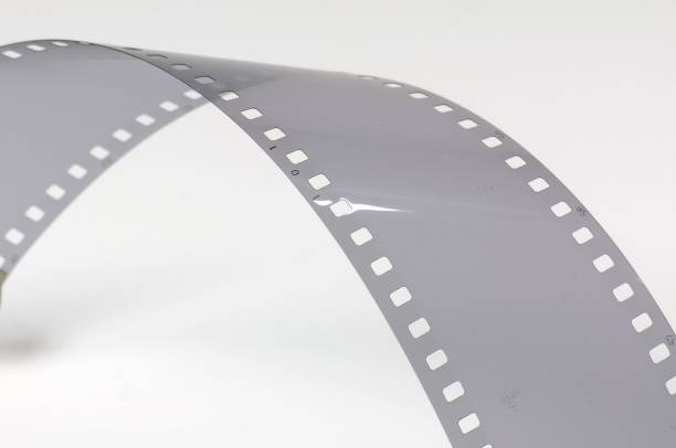 Twisted gray film strip on white background.