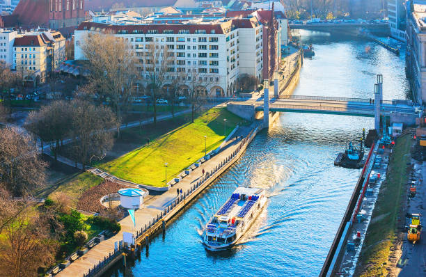 istock Cityscape and excursion ship on Spree river in Berlin 906798050