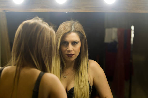 istock Young woman dancer checking mirror and posing in studio at istanbul turkey 906800780