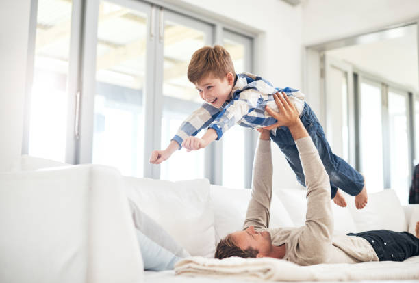 istock Raising him up to new heights 906801146