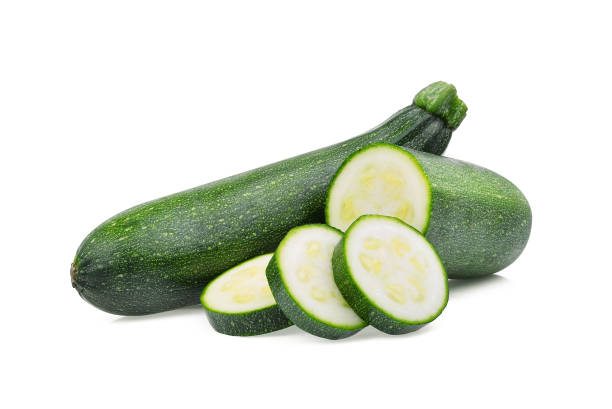 istock fresh green zucchini with slice isolated on white background 906801298