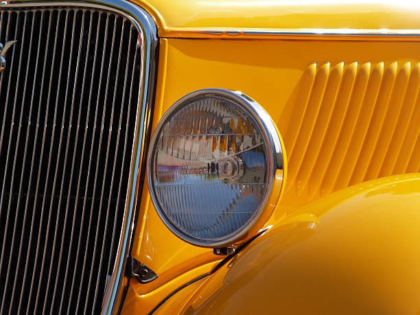 istock Front Light of Yellow Classic Car 90680619