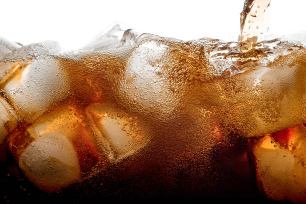 istock Pouring cola soda with ice and bubble on front view white background cold drink beverage 906806832