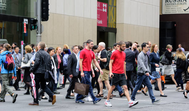 istock People crowd crossing street in central Sydney 906806974
