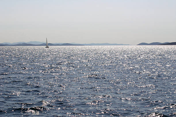 istock Kornati: backlight on the sea, with islands & boat 90680939