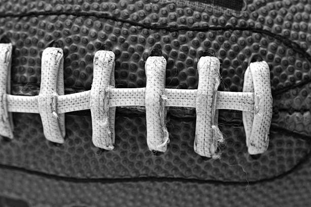 bw football stitches stock photo