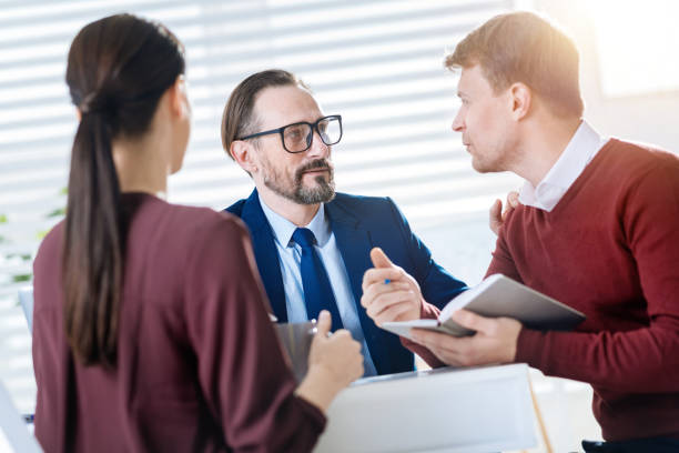 istock Serious three colleagues coming up with ideas 906816174