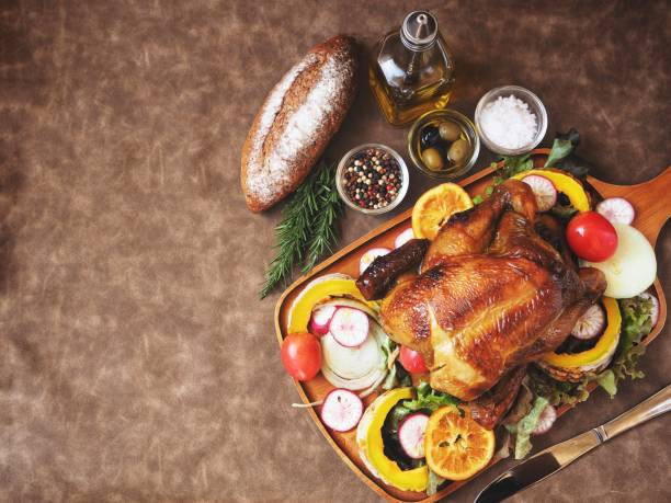 istock Roasted turkey in thanksgiving on brown background 906819662