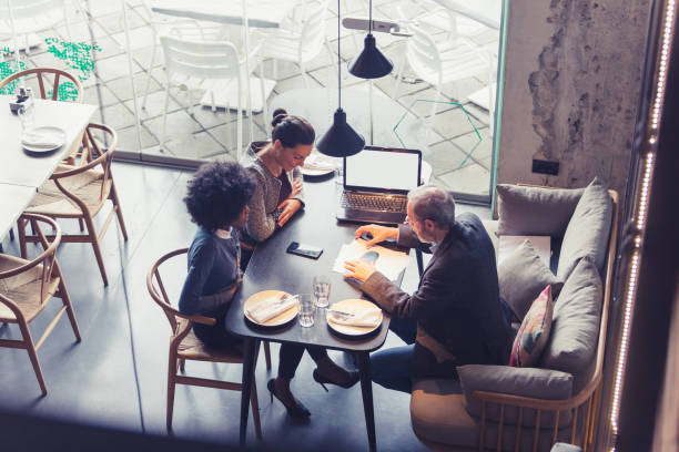 istock Co-Working Space in High-End Restaurants. Businesspeople having meeting In a restaurant. 906822252
