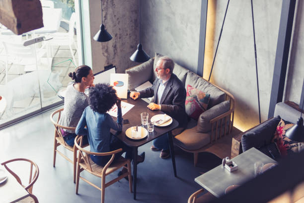istock Co-Working Space in High-End Restaurants. Businesspeople having meeting In a restaurant. 906822264