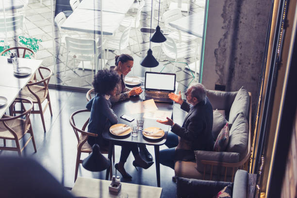 istock Co-Working Space in High-End Restaurants. Businesspeople having meeting In a restaurant. 906824212