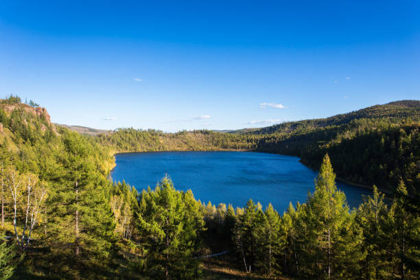 istock Crater Lake scenery surrounded by forests 906826564