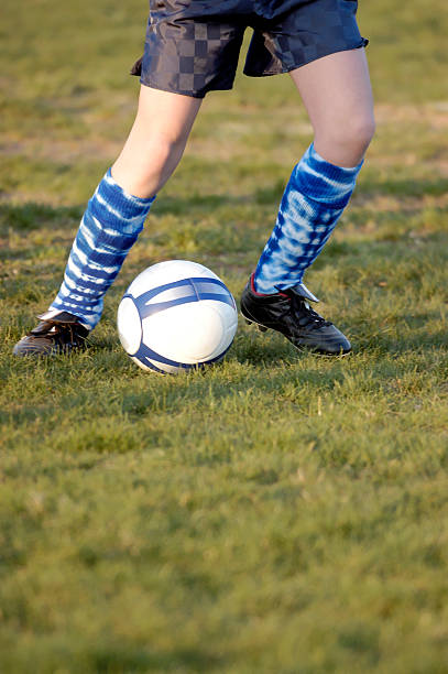 istock Soccer shoes and ball 90682736