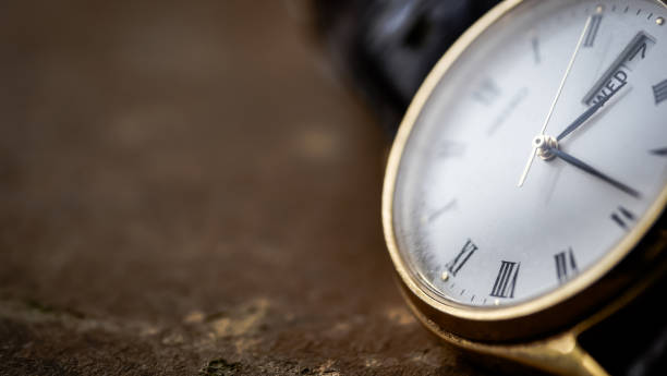 istock Close up front view of a modern wrist watch on the table. Soft focus. Free space for text 906829888