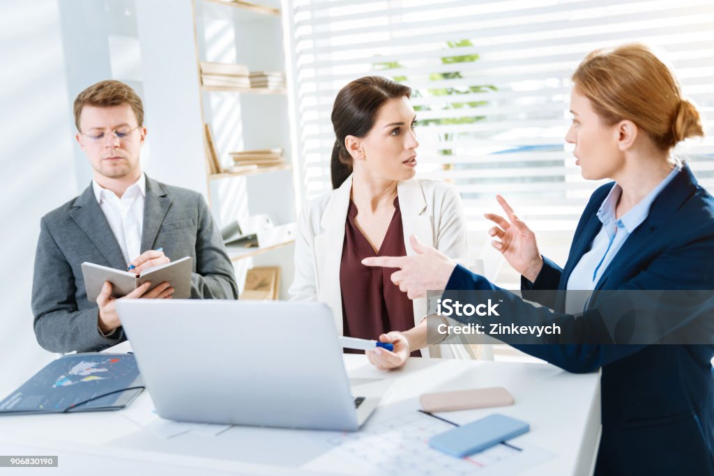 Colleagues Arguing Attractive Three Colleagues Arguing Over Issue Stock Photo - Download ...