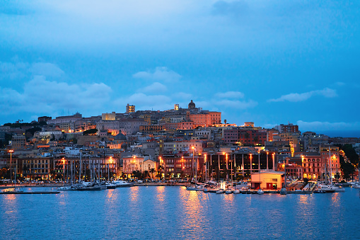 Cityscape with marina in the Mediterranian sea in the evening in Cagliari, Sardinia, Italy