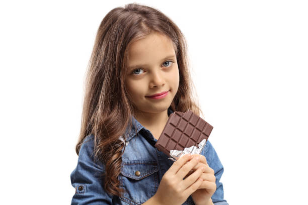 istock Girl with a chocolate bar 906833500