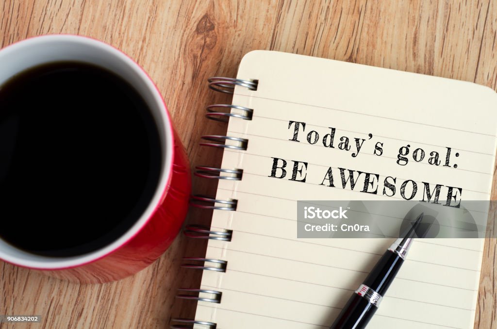 Inspirational Quote - Today's Goal, Be Awesome Today's goal - Be awesome text on notepad with pen and a cup of coffee, wooden background Happiness Stock Photo