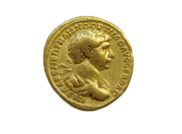 Gold Roman aureus coin of Roman emperor Trajan Gold Roman aureus coin of Roman emperor Trajan AD 98-117 isolated on a white background aureus stock pictures, royalty-free photos & images