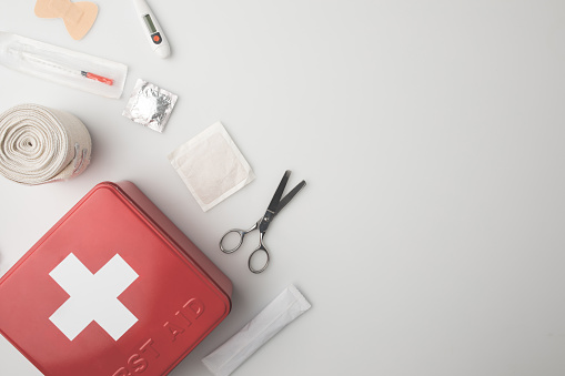 Top view of medicine chest with medical supplies isolated on white