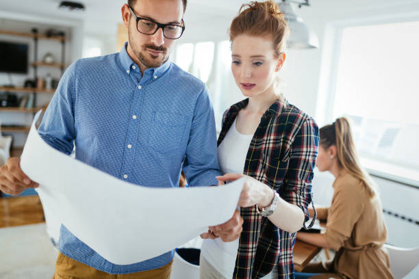 istock Image of business partners discussing documents and ideas 906838330