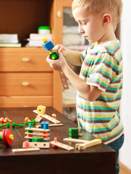 istock Little boy playing with toys having fun 906841672
