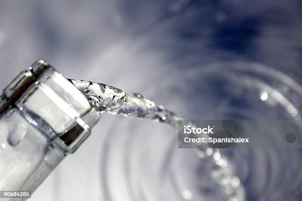 Water Flowing From Bottle Stock Photo - Download Image Now - Alcohol - Drink, Bottle, Cocktail