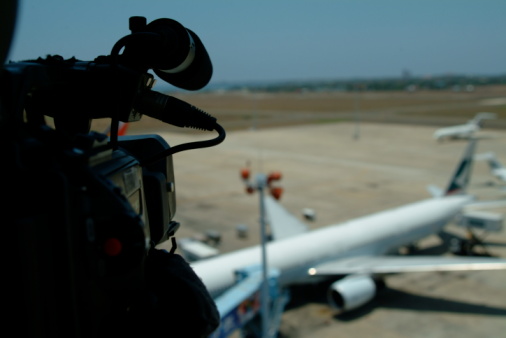 A video shoot at a busy airport.