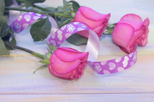 istock The concept of holidays with pink roses 906850940