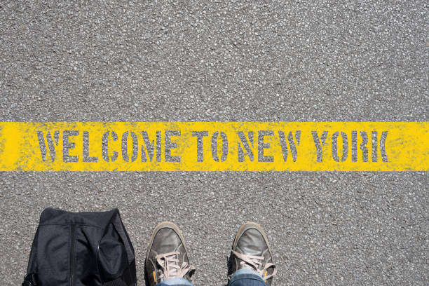 istock A man with a suitcase stands in front of New York 906853658