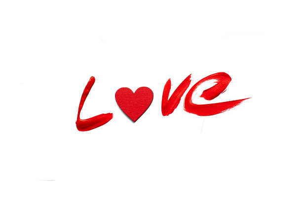 istock Painted red love word isolated on white background. Love concept. 906857088