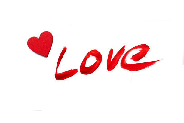 istock Painted red love word isolated on white background. Love concept. 906857090