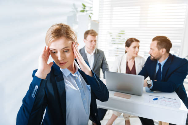 istock Upset female colleague experiencing stress at work 906857108