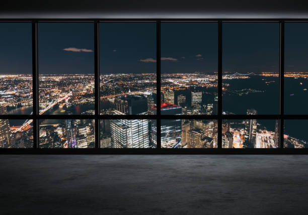 istock Window View of Illuminated New York Skyline 906858214