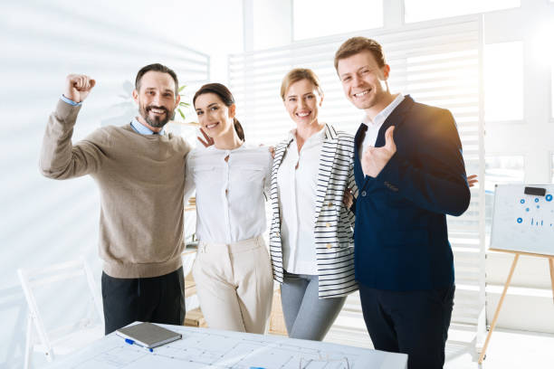 istock Vigorous  four  colleagues finishing working day 906861234