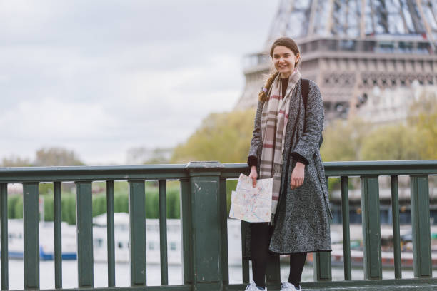 istock Happy tourist woman enjoying Paris 906863020