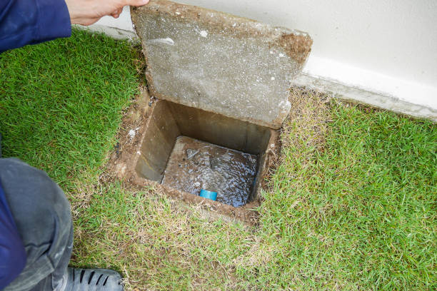 Worker hand open sewer of new house