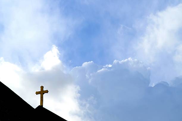 istock A dark cross against a blue sky  90686625